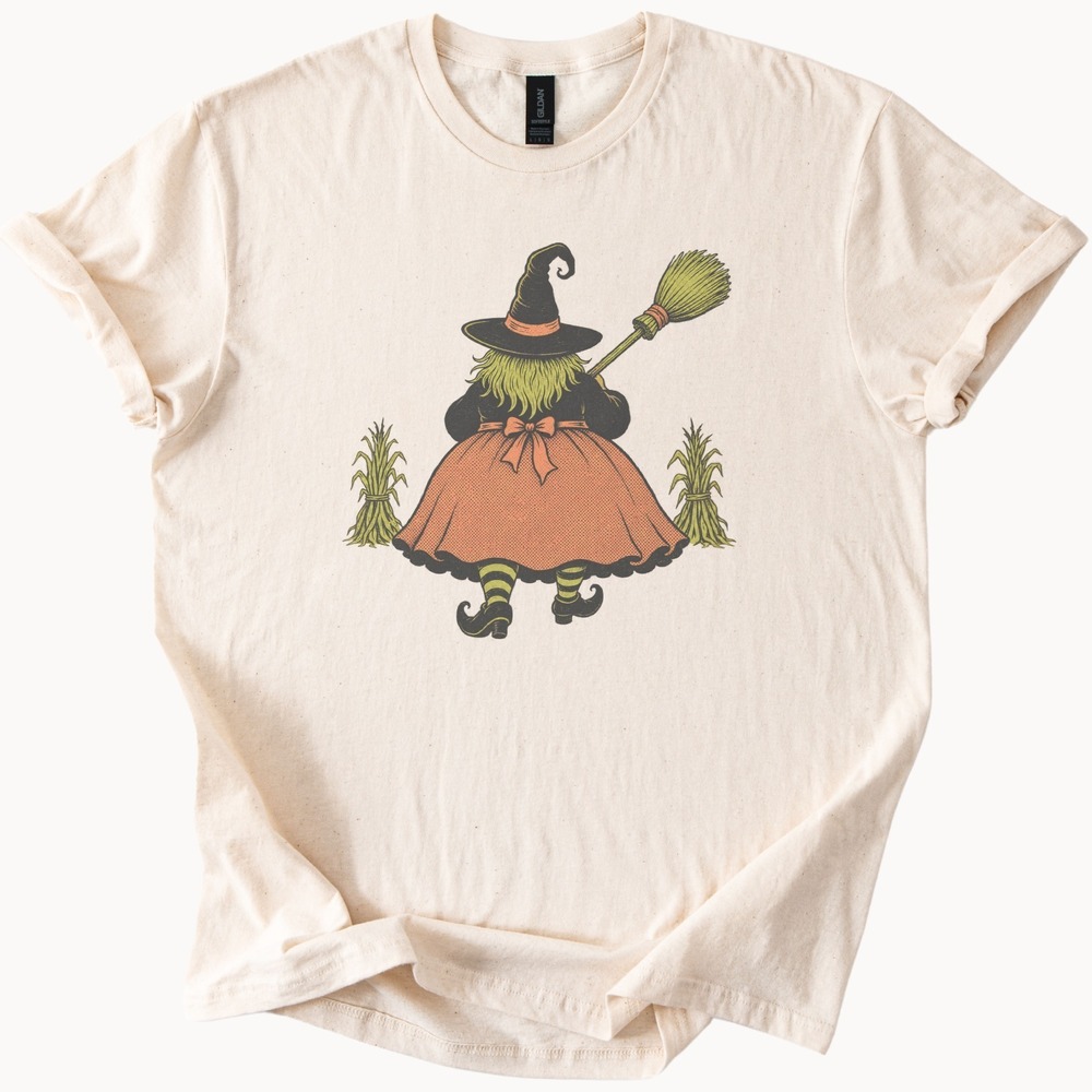Plump Witch Carrying Her Broom Past the Corn Sheaves Tee